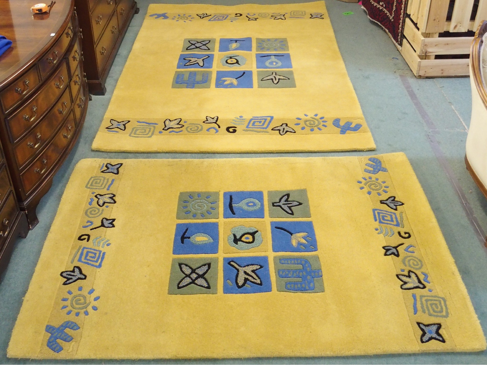 Appraisal: Two contemporary gold Indian rugs x cm and x cm