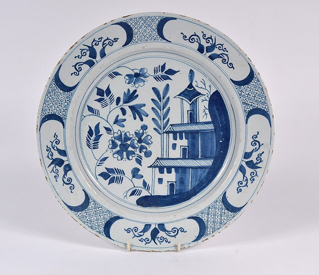 Appraisal: An English Delftware blue and white chargerwith Chinese designs cm