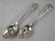 Appraisal: A pair of Georgian Irish Hourglass pattern berry spoons maker's