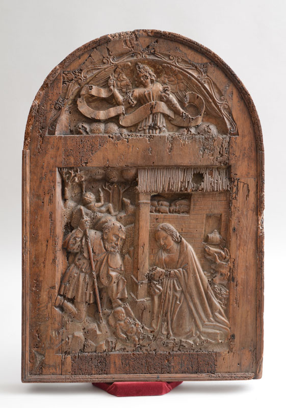 Appraisal: NORTHERN EUROPEAN RELIEF-CARVED WALNUT ARCHED PANEL Depicting the nativity of