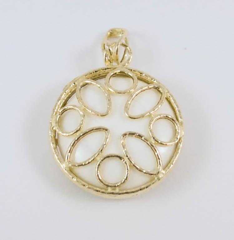 Appraisal: ITALIAN FOURTEEN KARAT GOLD PENDANT with a round white stone