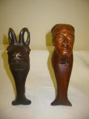 Appraisal: A PAIR OF BAVARIAN STAINED WOOD NUTCRACKERS modelled as the