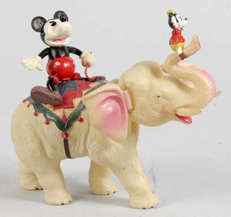 Appraisal: Celluloid Mickey Minnie on Elephant Wind-Up Toy Description Japanese Pre-war