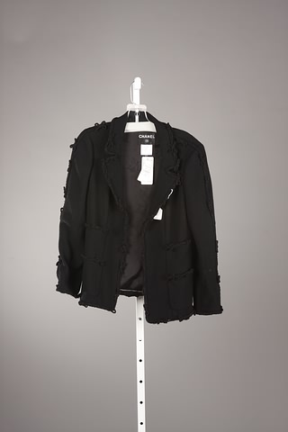 Appraisal: Chanel black wool jacket with black bows as all-around trim