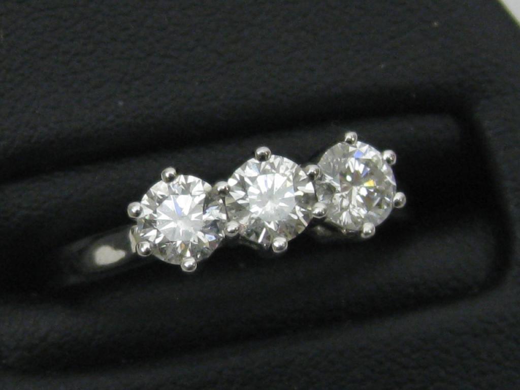 Appraisal: A three stone Diamond Ring the circular-cut stones claw-set in