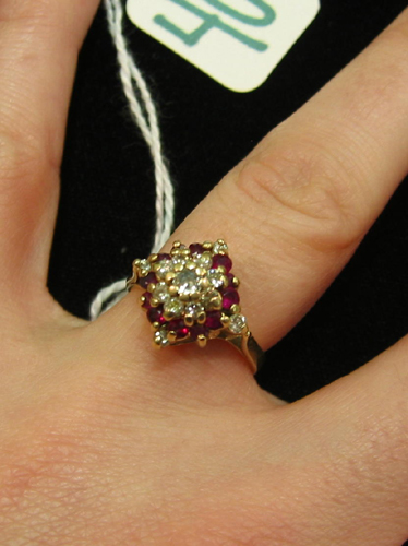 Appraisal: RUBY DIAMOND AND FOURTEEN KARAT GOLD CLUSTER RING set with