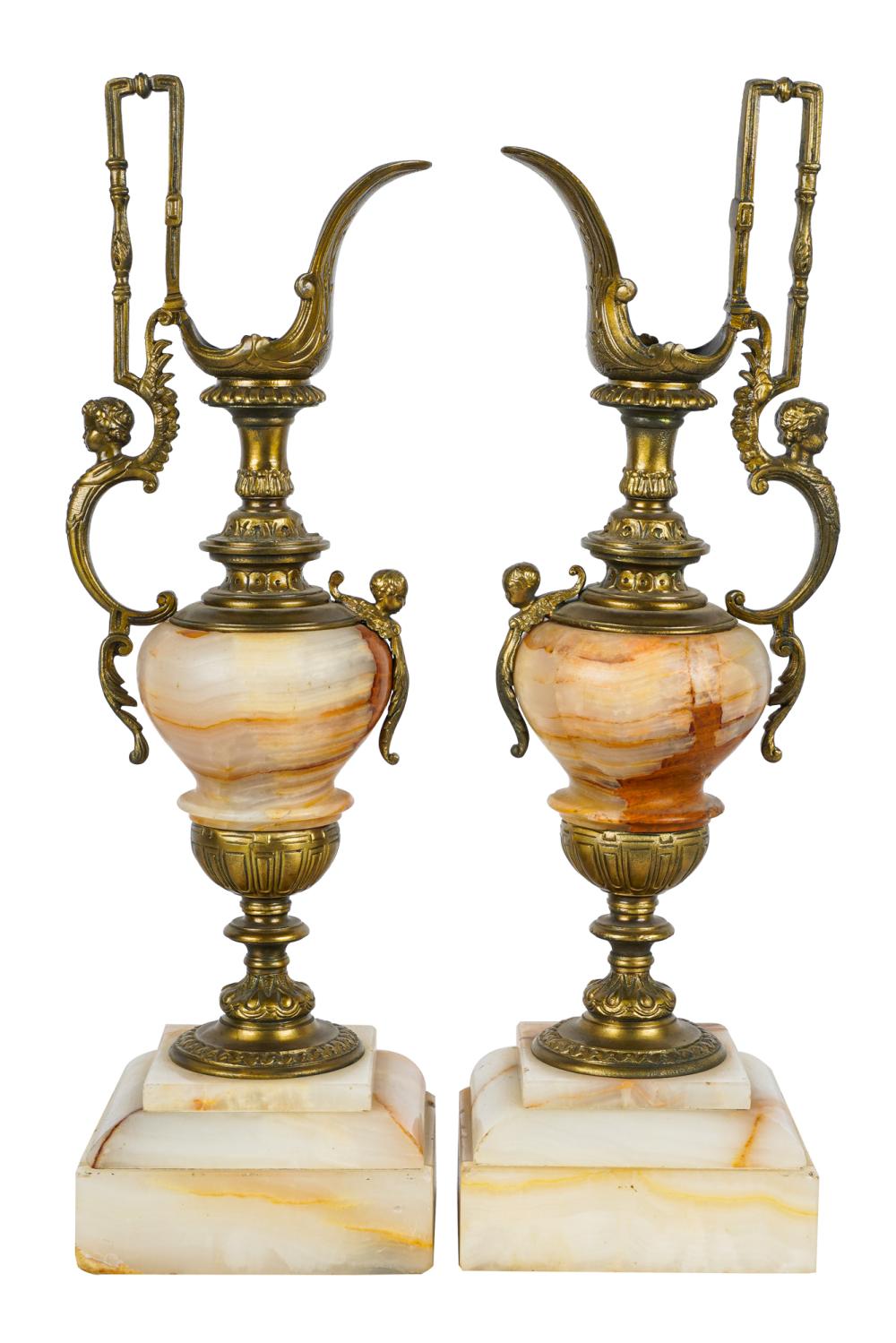 Appraisal: PAIR OF ONYX GILT METAL EWERSCondition good A few fleabite