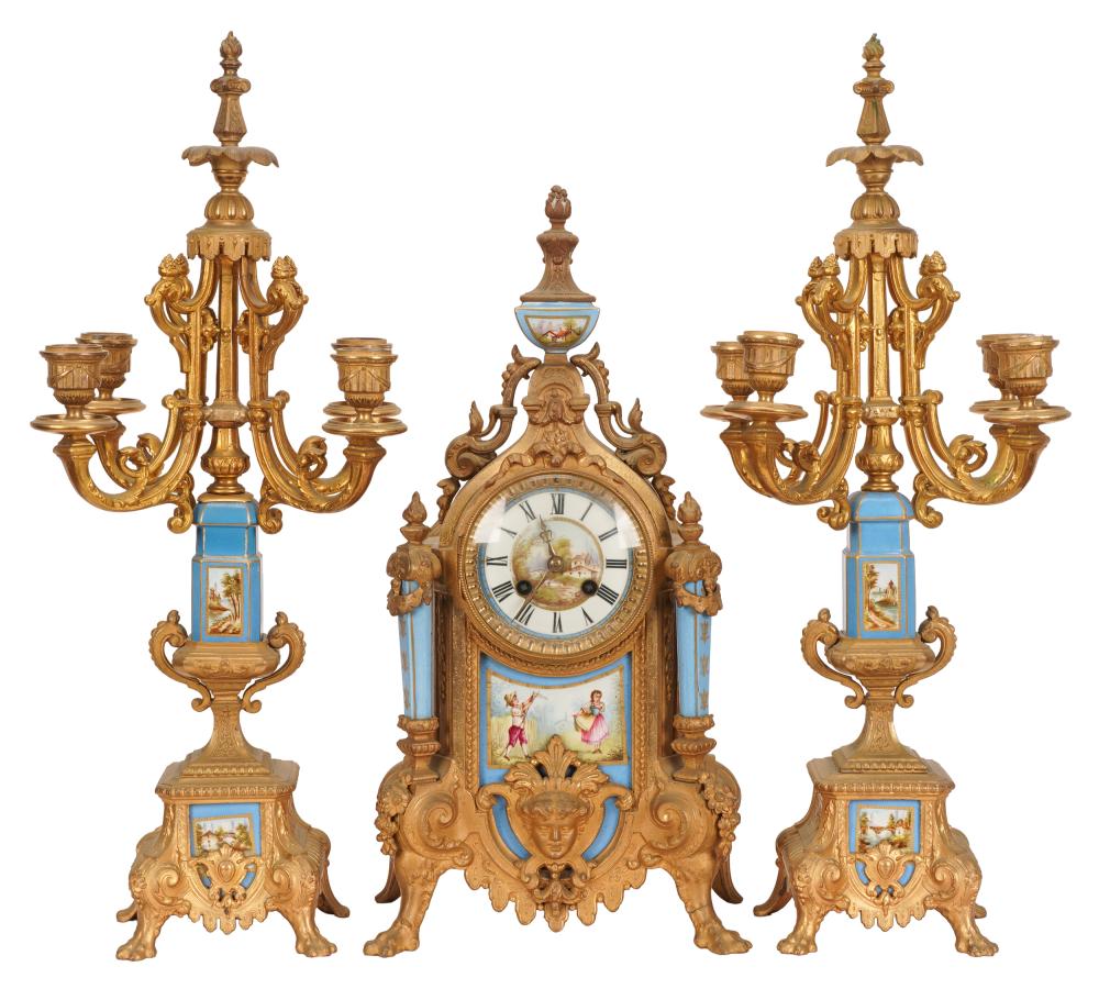 Appraisal: THREE-PIECE CLOCK GARNITUREenameled porcelain and gilt bronze the clock movement