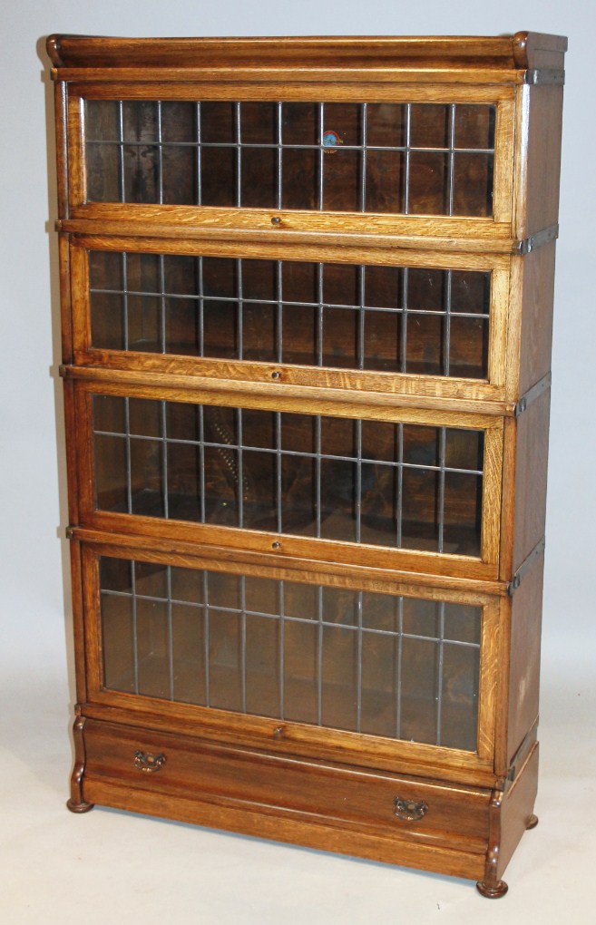 Appraisal: A thC Globe Wernicke bookcase in four sections with drawer