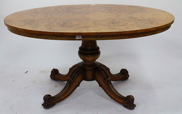 Appraisal: A VICTORIAN BURR WALNUT TILT TOP TABLE on quadripartite base