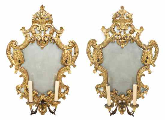 Appraisal: A Pair of Rococo Style Giltwood Mirrors th century of