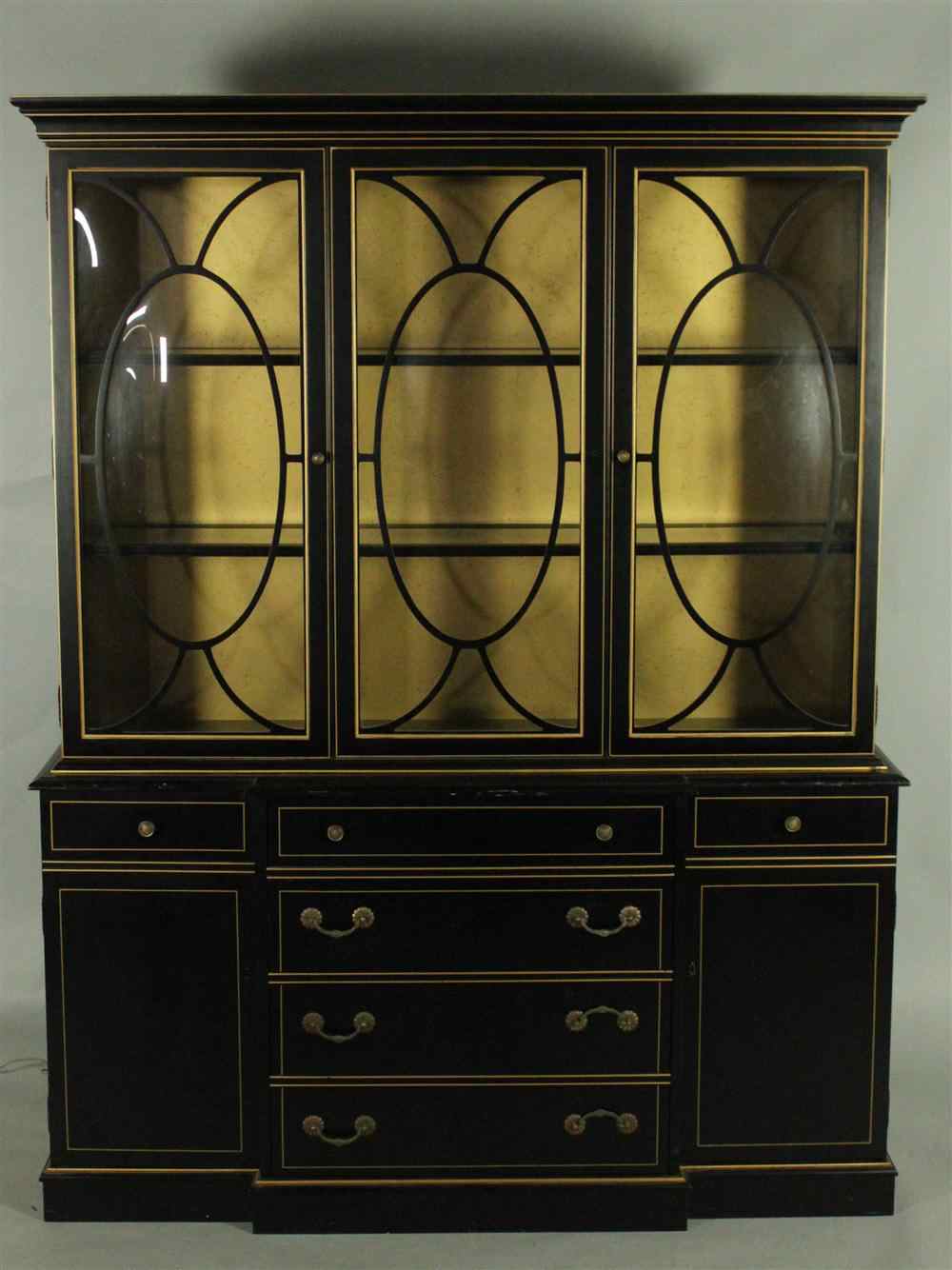 Appraisal: GEORGIAN STYLE EBONIZED AND GILT BREAKFRONT having an upper section