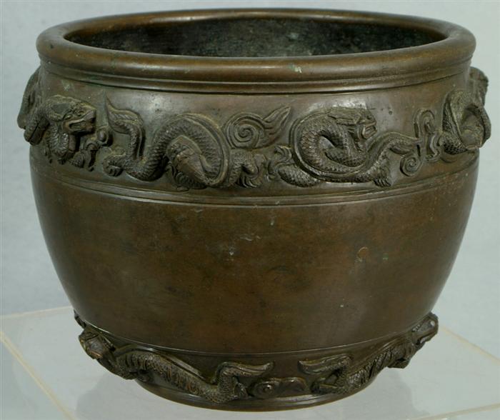 Appraisal: Chinese bronze cachepot heavily carved with dragons and flaming pearls