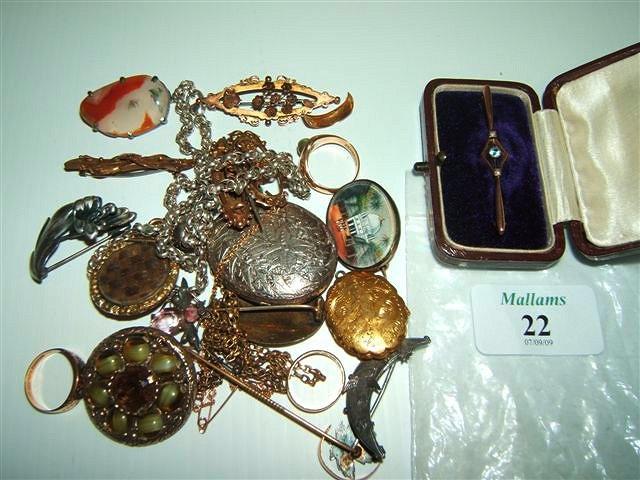 Appraisal: Various gold rings gold brooches a silver locket and chain