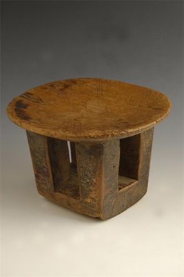 Appraisal: A small carved wood stool the oblong top with incised