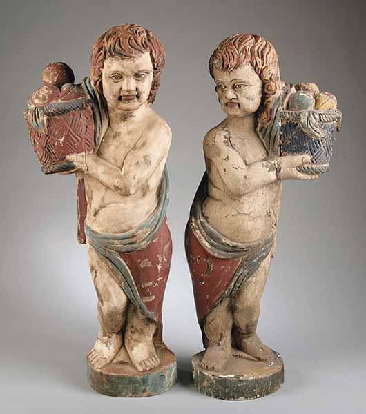 Appraisal: A Pair of Continental Carved Figures of Classically Draped Boys