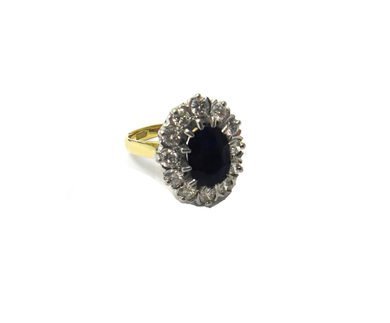 Appraisal: A gold sapphire and diamond set oval cluster ring claw