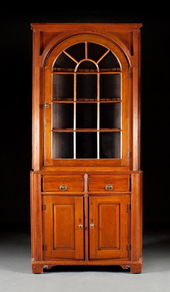 Appraisal: Federal pine glazed panel two-part corner cupboard late th early