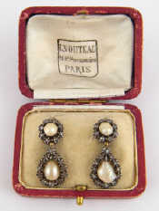 Appraisal: A pair of antique silver pearl and diamond earrings with