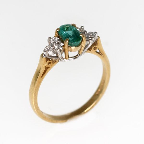 Appraisal: EMERALD AND DIAMOND RING k wg and yg England Oval