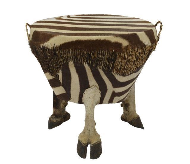 Appraisal: Zebra hide drum table likely Africa conical form upholstered with