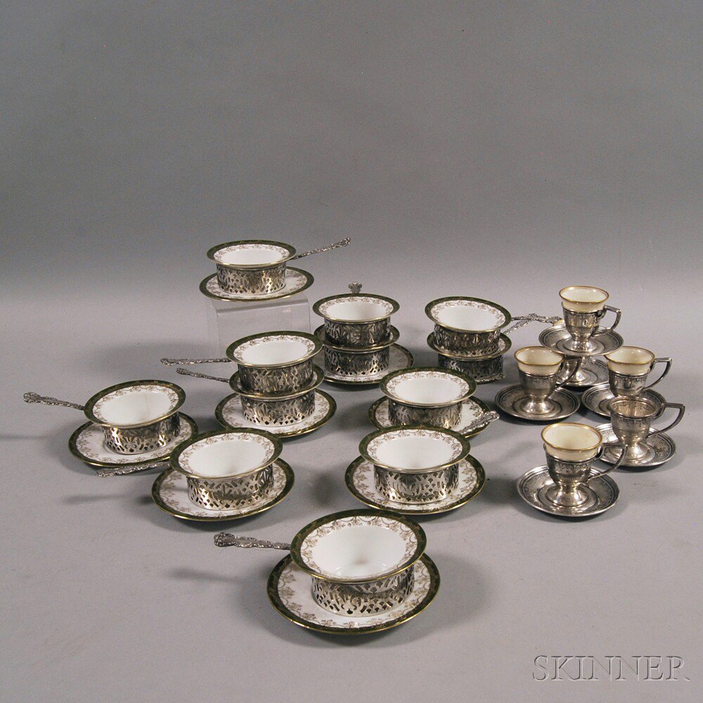 Appraisal: Two Sets of Sterling Silver and Porcelain Cups and Saucers