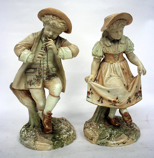 Appraisal: A PAIR OF ROYAL WORCESTER PORCELAIN FIGURINES a shepherd and