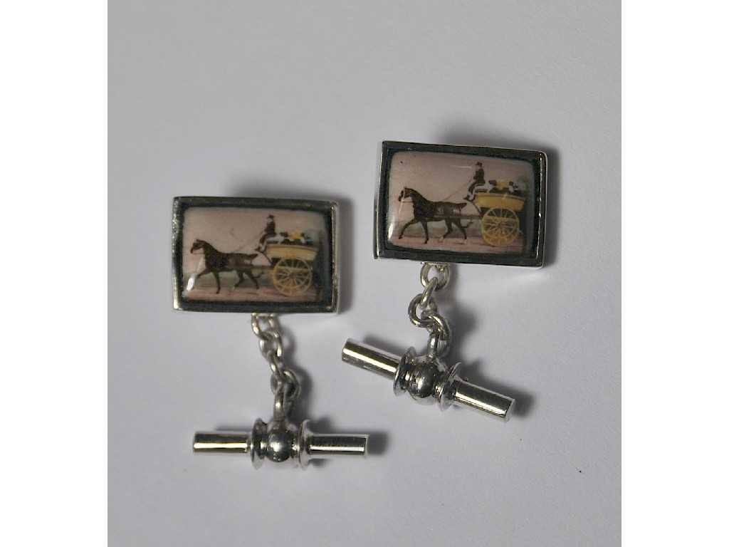 Appraisal: Pair of rectangular white metal cufflinks featuring porcelain plaques of