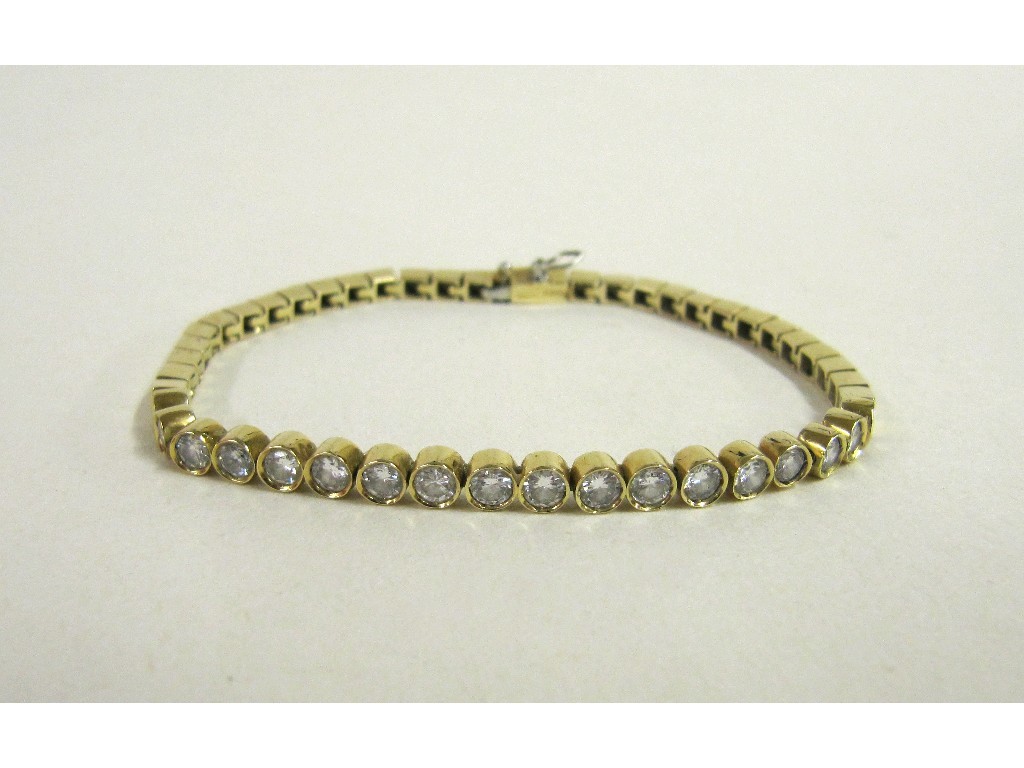 Appraisal: Fourteen carat gold diamond line bracelet with collet set brilliant