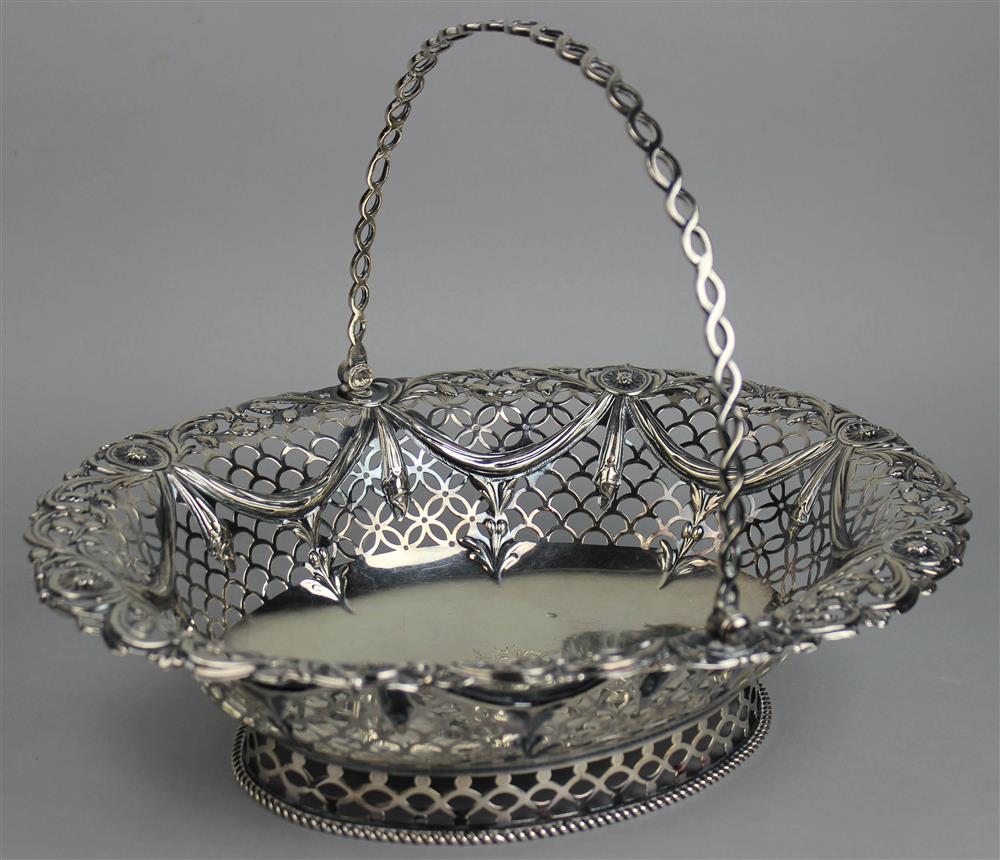 Appraisal: ENGLISH SILVER OVAL SWING HANDLED CAKE BASKET London maker's mark