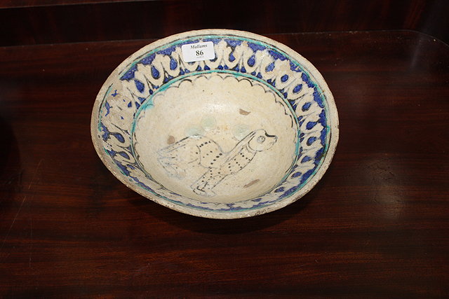 Appraisal: AN ANTIQUE IZNIK POTTERY BOWL decorated in dark blue and