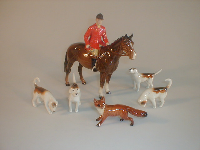 Appraisal: A Beswick hunt set comprising huntsman on a brown horse