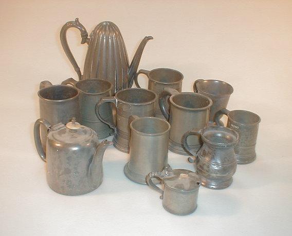 Appraisal: A collection of old pewter mugs and measures a pewter