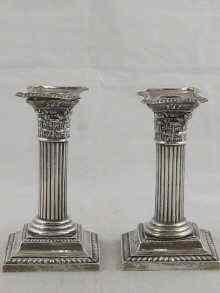 Appraisal: A pair of Corinthian column candle sticks hallmarked for Birmingham