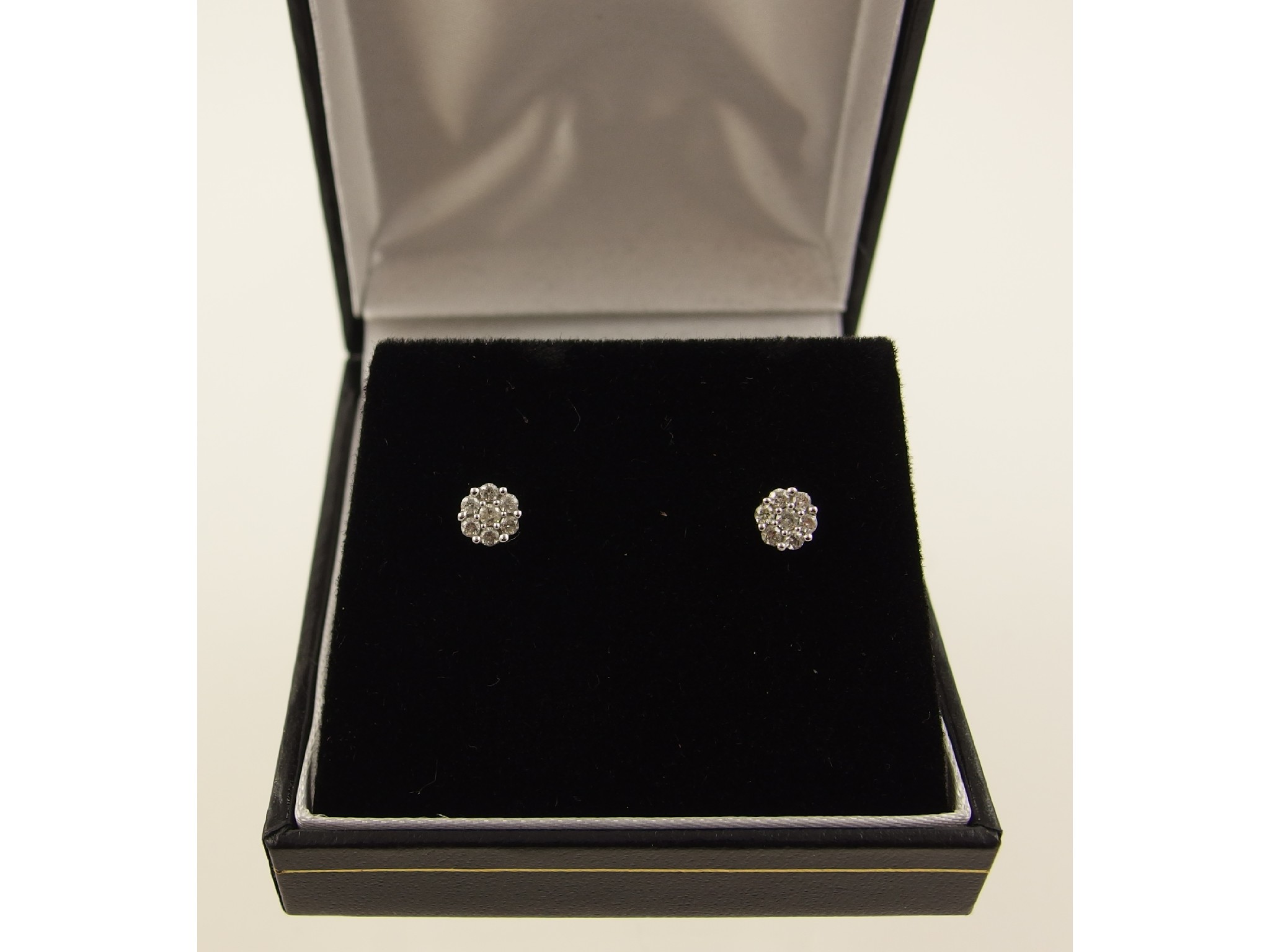 Appraisal: A pair of ct white gold daisy cluster earrings each