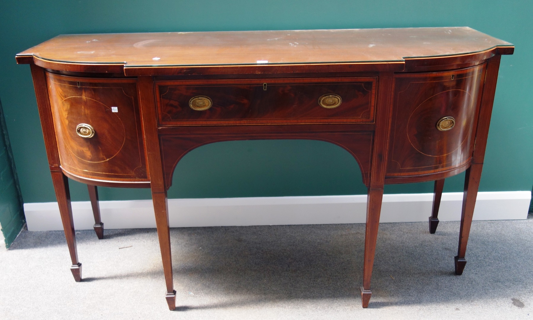 Appraisal: A th century inlaid mahogany bowfront sideboard with three frieze