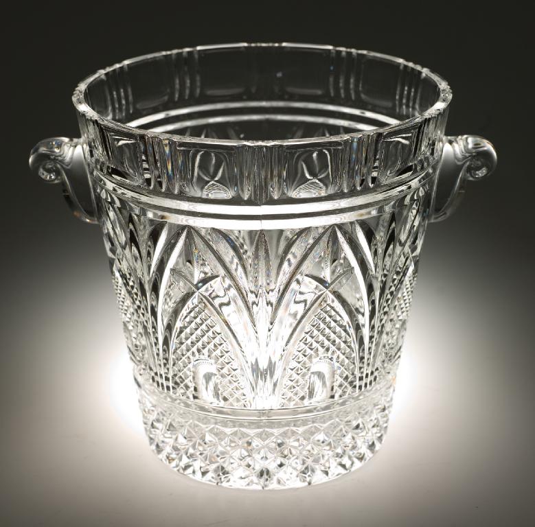 Appraisal: HANDSOME PRESSED GLASS CHAMPAGNE BUCKET with scroll handles moulded in