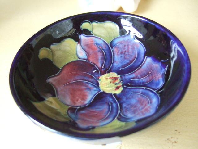 Appraisal: A Moorcroft pedestal dish decorated with hibiscus flowers against a