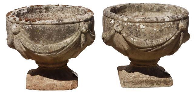 Appraisal: pair Cast stone urn garden planters th c swag surround