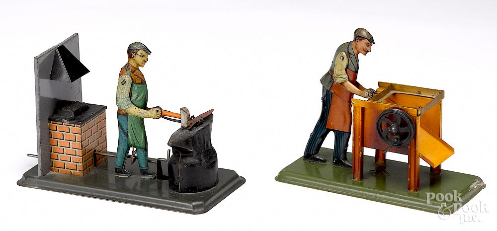 Appraisal: Two tin lithograph workmen steam toy accessories Two tin lithograph