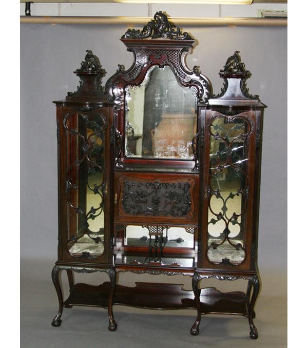 Appraisal: Edwardian etagere w diverse style elements carved mahogany frame two