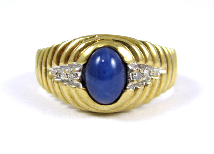 Appraisal: MAN'S SYNTHETIC STAR SAPPHIRE AND DIAMOND RING k yellow gold