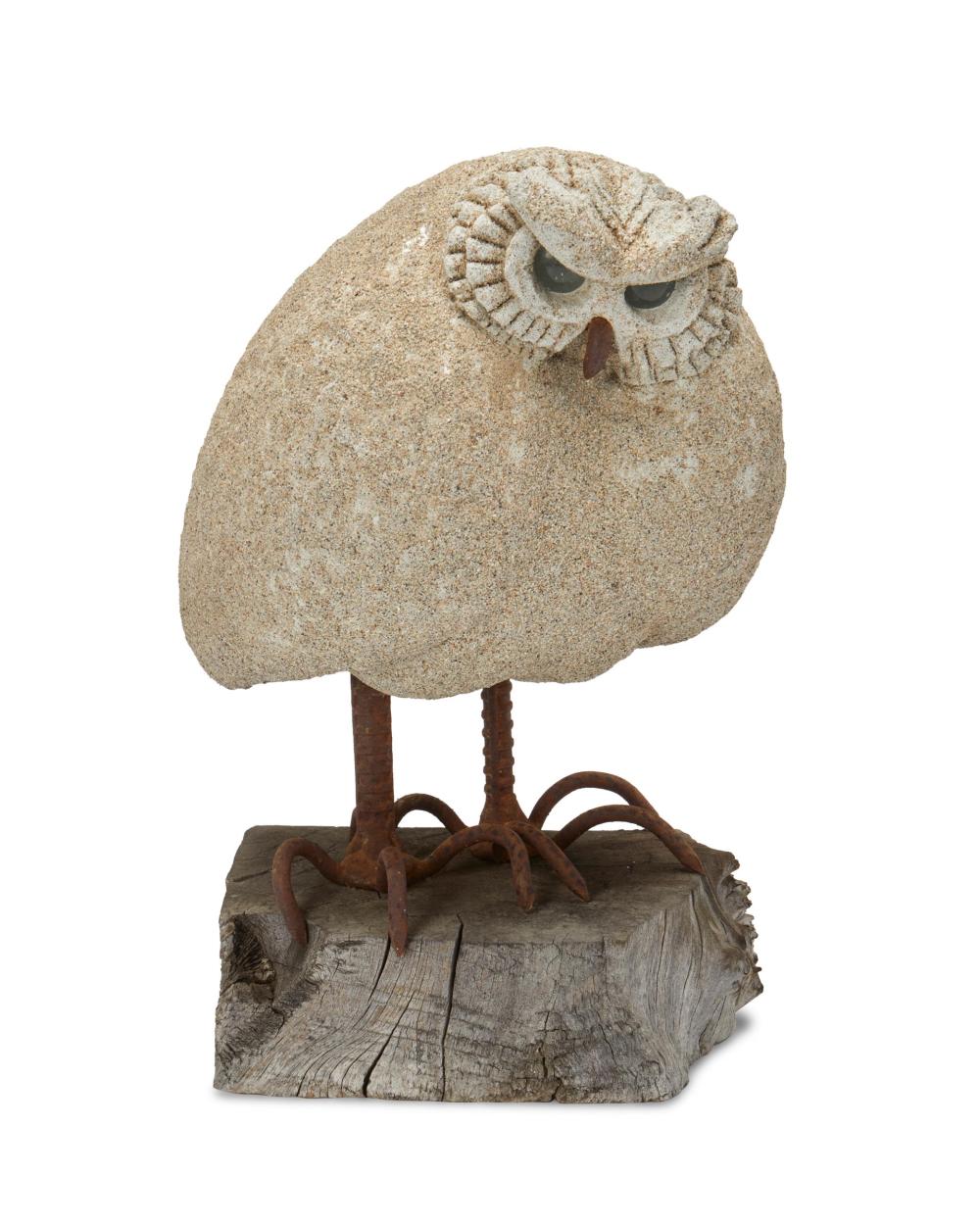 Appraisal: A CAST STONE OWL WITH GLASS EYESA cast stone owl