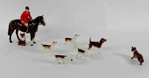 Appraisal: A Beswick figure of a huntsman on a horse cm