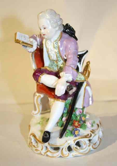 Appraisal: A MEISSEN FIGURE of a young boy in period costume