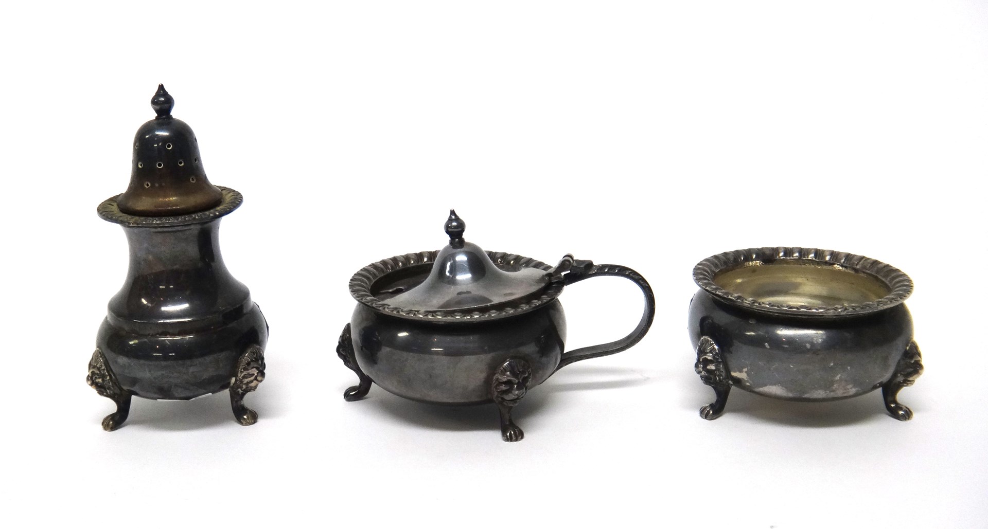 Appraisal: A silver three piece condiment set comprising a mustard pot