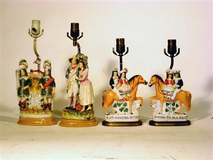 Appraisal: Four Staffordshire figural groups fitted as lamps Mid- th century