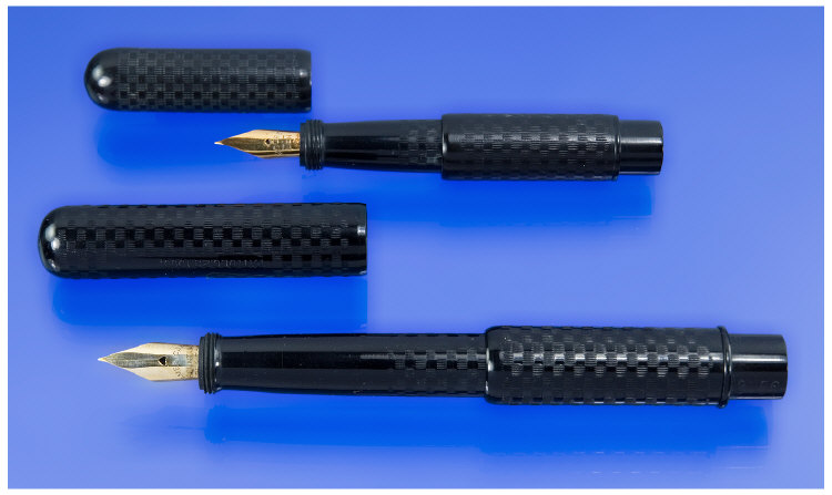 Appraisal: Two black hard rubber Moore safety pens in excellent condition