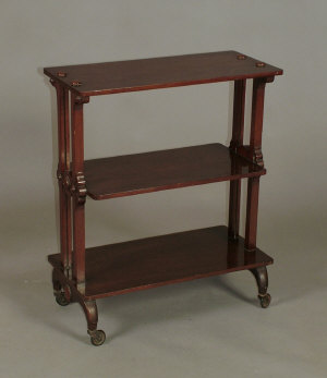 Appraisal: A Victorian mahogany and walnut three tier whatnot the rounded