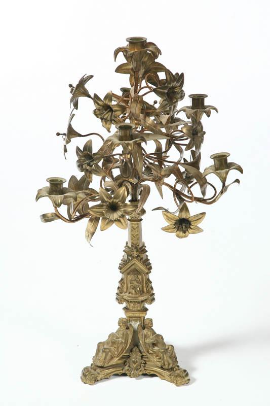 Appraisal: ECCLESIASTICAL CANDELABRA Attributed to Russia late th century brass Trefoil